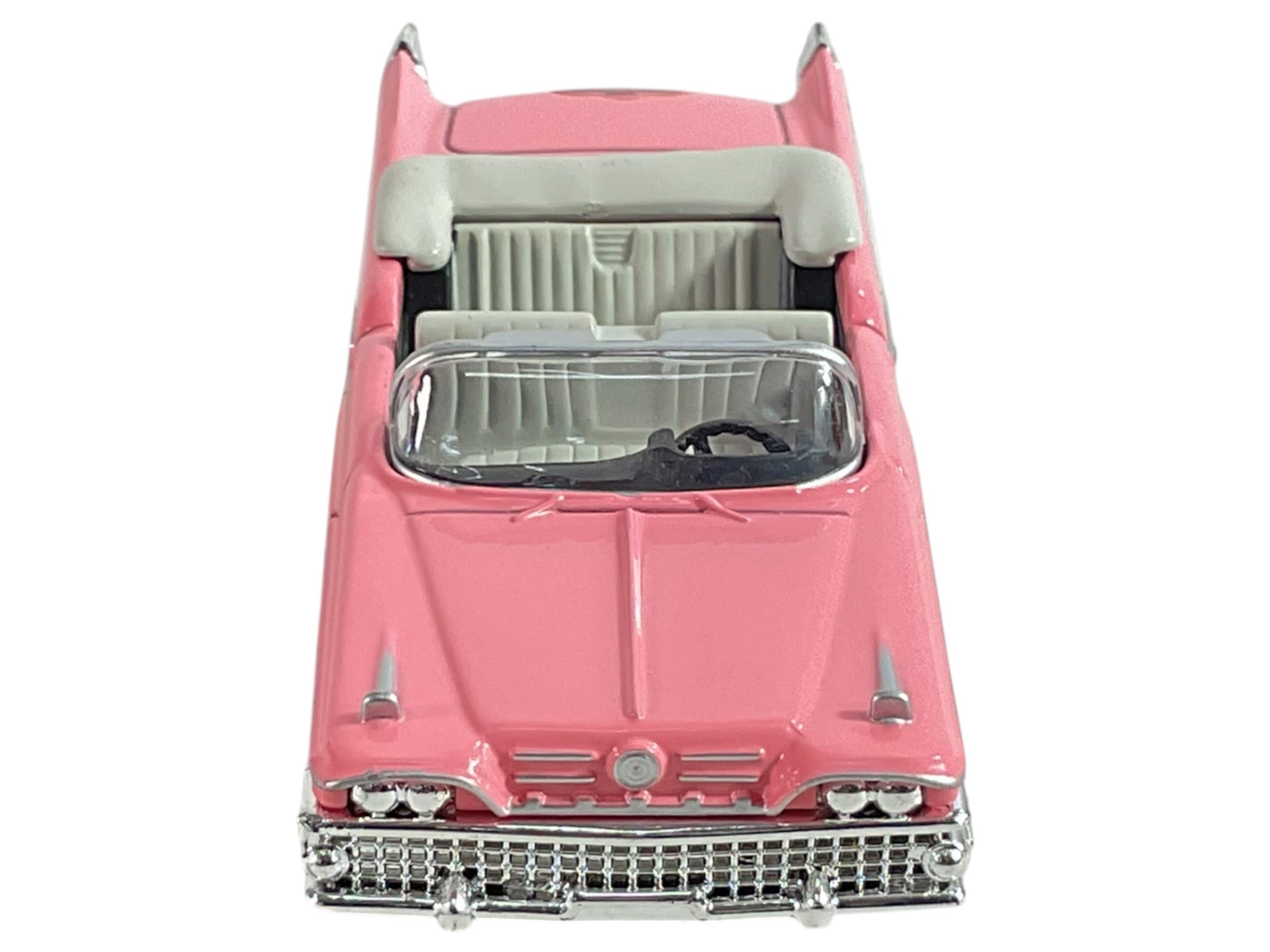 Automóvil convertible Buick color rosa, vista frontal y lateral