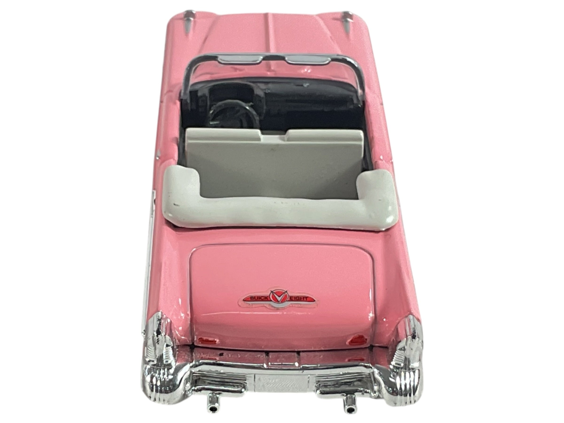 Automóvil convertible Buick color rosa, vista posterior